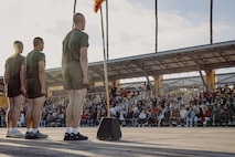 The family and friends of the new U.S. Marines with Delta Company, 1st Recruit Training Battalion, observe their Marines conduct dynamic warm-ups prior to the motivational run at Marine Corps Recruit Depot San Diego, California, Oct. 31, 2024. The company motivational run is a three-mile cadence run conducted around the Depot and is the last physical training event the Marines will conduct before the graduate from MCRD San Diego. The event is also the first time friends and families will see their newly transformed Marines. (U.S. Marine Corps photo by Cpl. Sarah M. Grawcock)