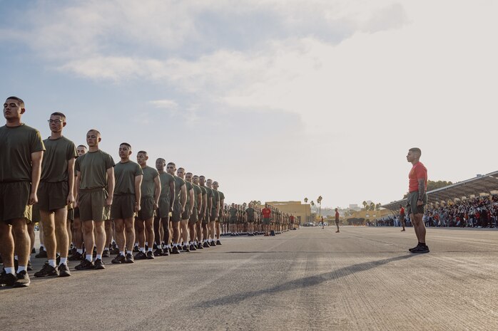 U.S. Marines with Delta Company, 1st Recruit Training Battalion, stand in formation before their motivational run at MCRD San Diego, California, Oct. 31, 2024. The company motivational run is a three-mile cadence run conducted around the Depot and is the last physical training event the Marines will conduct before the graduate from MCRD San Diego. The event is also the first time friends and families will see their newly transformed Marines. (U.S. Marine Corps photo by Cpl. Sarah M. Grawcock)