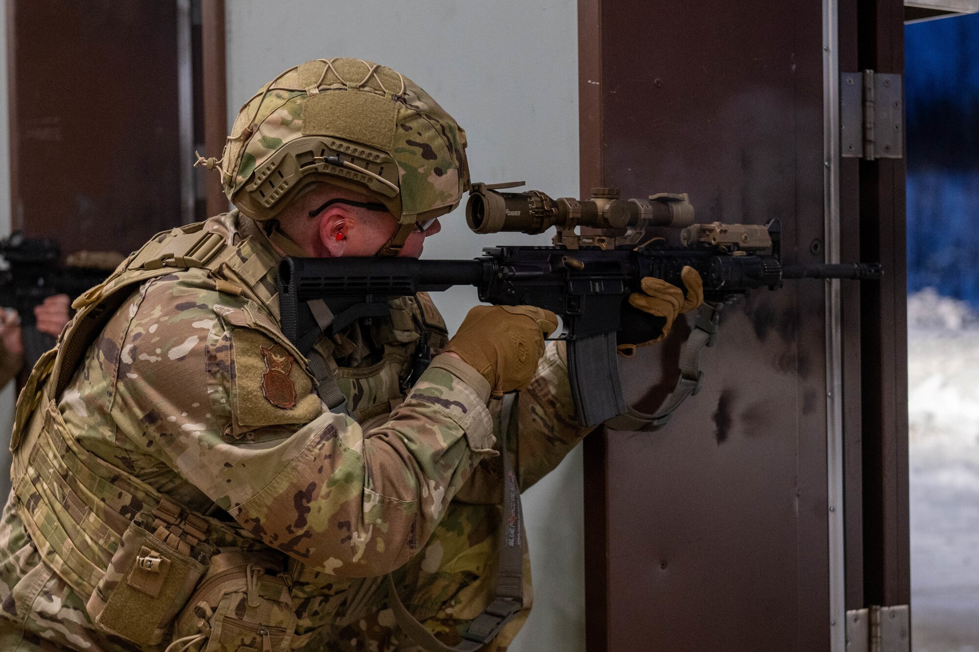 U.S. Air Force Tech. Sgt. Derek Matteson, 354th Security Forces Squadron Counter-Small Unmanned Aerial Systems program manager, fires a M4A1 carbine during an annual qualifications training course at Eielson Air Force Base, Alaska, Oct. 28, 2024.