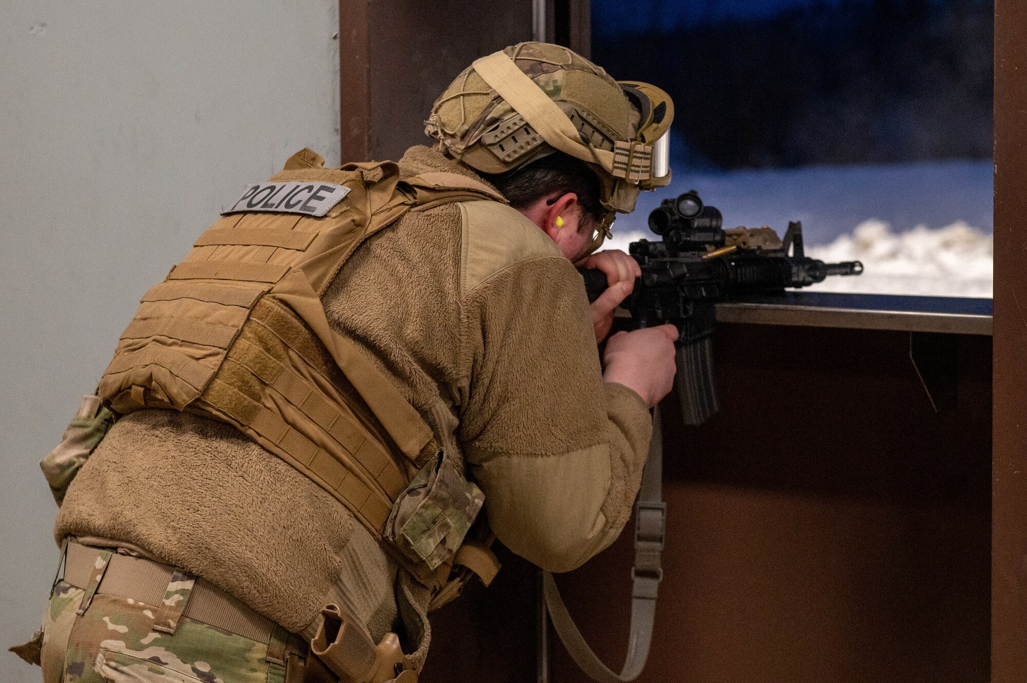 U.S. Air Force Senior Airman Matthew Reyes, 354th Security Forces Squadron installation entry controller, fires a M4A1 carbine during an annual qualifications training course at Eielson Air Force Base, Alaska, Oct. 28, 2024.