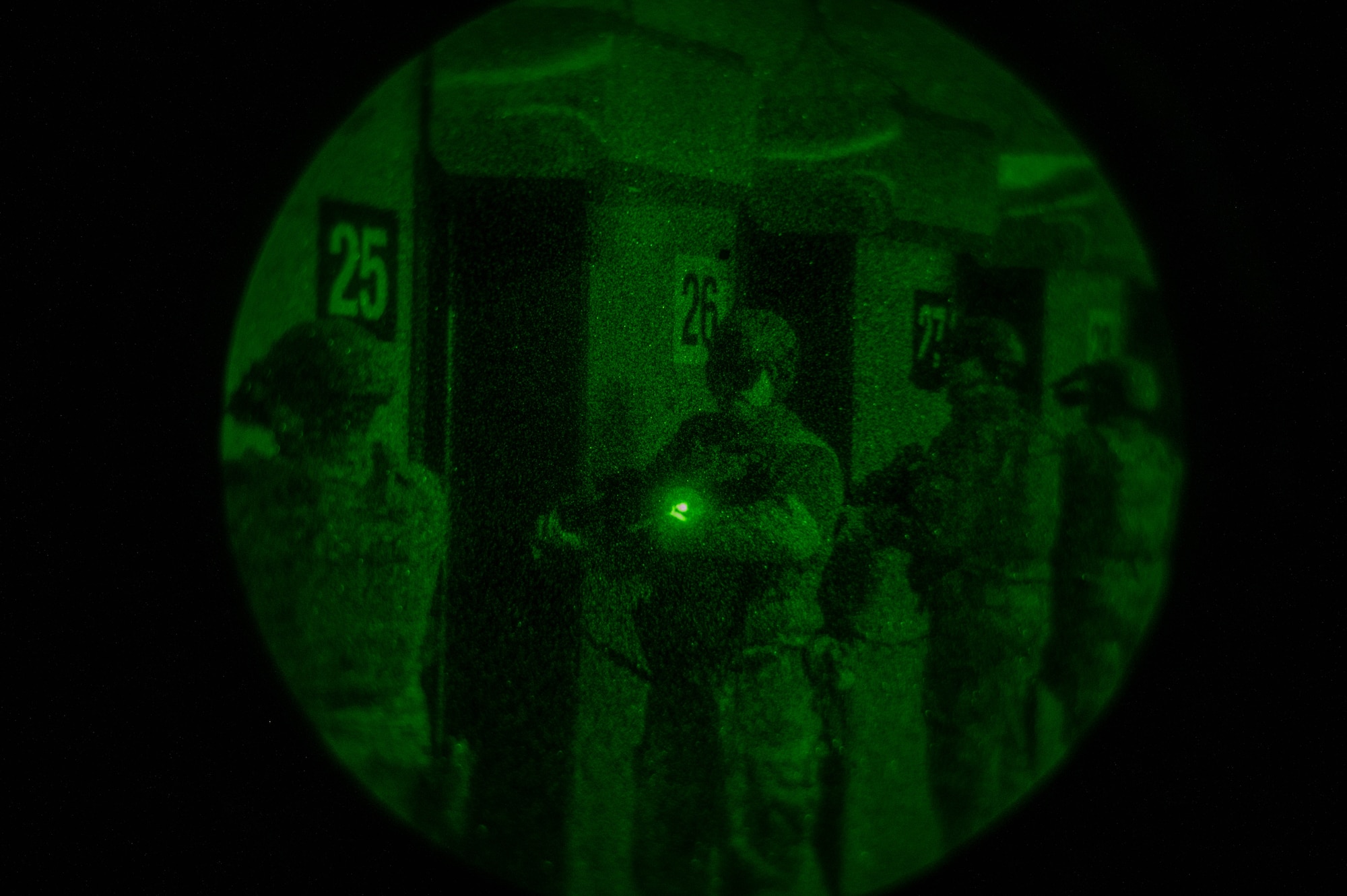 U.S. Air Force Senior Airman Nicholas Griteman, 354th Security Forces Squadron response force leader, stands ready to shoot an M4A1 carbine with night vision goggles during an annual qualifications training course at Eielson Air Force Base, Alaska, Oct. 28, 2024.