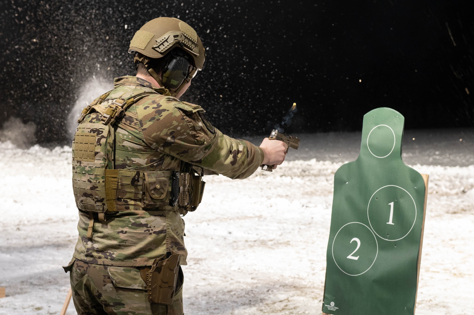 U.S. Air Force Airman 1st Class Tyler Vaden, 354th Security Forces Squadron installation entry controller, fires an M18 pistol during an annual qualifications training course at Eielson Air Force Base, Alaska, Oct. 28, 2024.