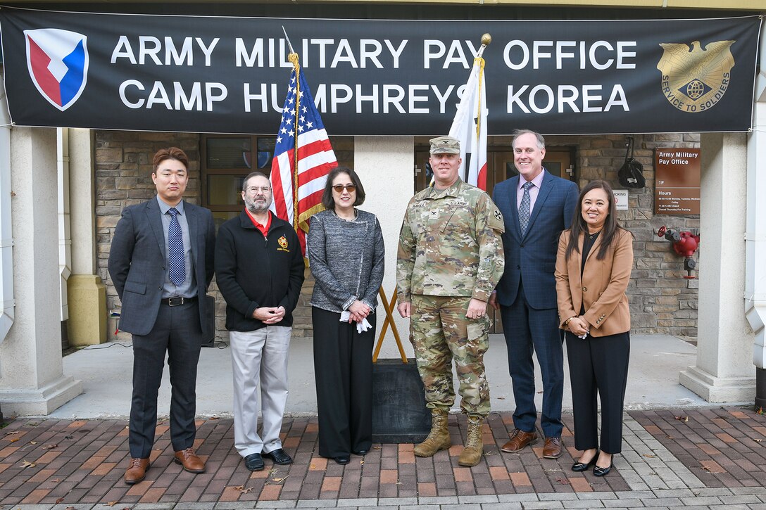 From left to right: Hyuk Mun, Army Military Pay Office Korea deputy director; Daniel M. Hancock, U.S. Army Garrison Humphreys deputy to the commander; Mary Jelev, U.S. Army Financial Management Command Military Pay Operations director; Col. Nicholas Paavola, Eighth Army assistant chief of staff (G8); Andrew Hyatt, U.S. Forces Korea assistant chief of staff (J8); and Patty White, AMPO Korea director, pose for a photo during a special ceremony opening AMPO Korea at Camp Humphreys, South Korea, Oct. 31, 2024. USAFMCOM opened the new AMPO on Camp Humphreys as well as two satellite locations at Camps Walker and Casey. (U.S. Army photo by Cpl. Kianna Scott)