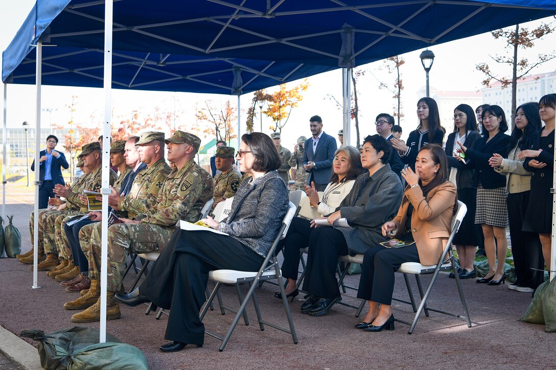 An audience of U.S. Army Soldiers, civilian employees and Korean Service Corps Battalion personnel listen to Daniel M. Hancock, U.S. Army Garrison Humphreys deputy to the commander, make remarks during a special ribbon-cutting ceremony opening AMPO Korea at Camp Humphreys, South Korea, Oct. 31, 2024. USAFMCOM opened the new AMPO on Camp Humphreys as well as two satellite locations at Camps Walker and Casey. (U.S. Army photo by Cpl. Kianna Scott)