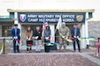 From left to right: Ki Sang Yi, Army Military Pay Office Korea Debt Management and Reserve Pay Section lead; Patty White; Patty White, AMPO Korea director; Daniel M. Hancock, U.S. Army Garrison Humphreys deputy to the commander; Mary Jelev, U.S. Army Financial Management Command Military Pay Operations director; Col. Nicholas Paavola, Eighth Army assistant chief of staff (G8); and Hyuk Mun, AMPO Korea deputy director, cut a ribbon at a special ceremony opening AMPO Korea at Camp Humphreys, South Korea, Oct. 31, 2024. USAFMCOM opened the new AMPO on Camp Humphreys as well as two satellite locations at Camps Walker and Casey. (U.S. Army photo by Cpl. Kianna Scott)