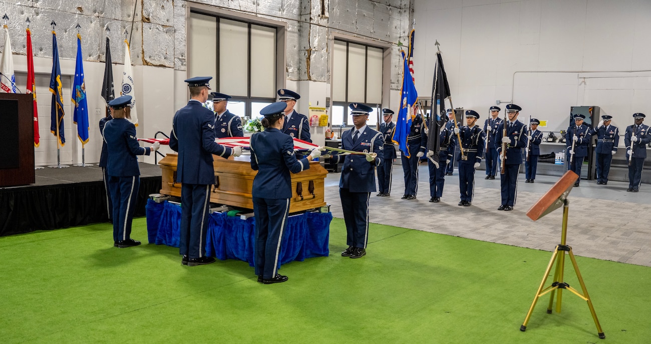 Base honor guard graduates demonstrate a six-man flag fold during a graduation ceremony at Wright-Patterson Air Force Base, Ohio, Oct. 30, 2024. The WPAFB Honor Guard provides military funeral honors for fallen veterans, retirees and active-duty service members and presents the colors for eligible retirement, promotion ceremonies and special events. (U.S. Air Force photo by Jack Gardner)