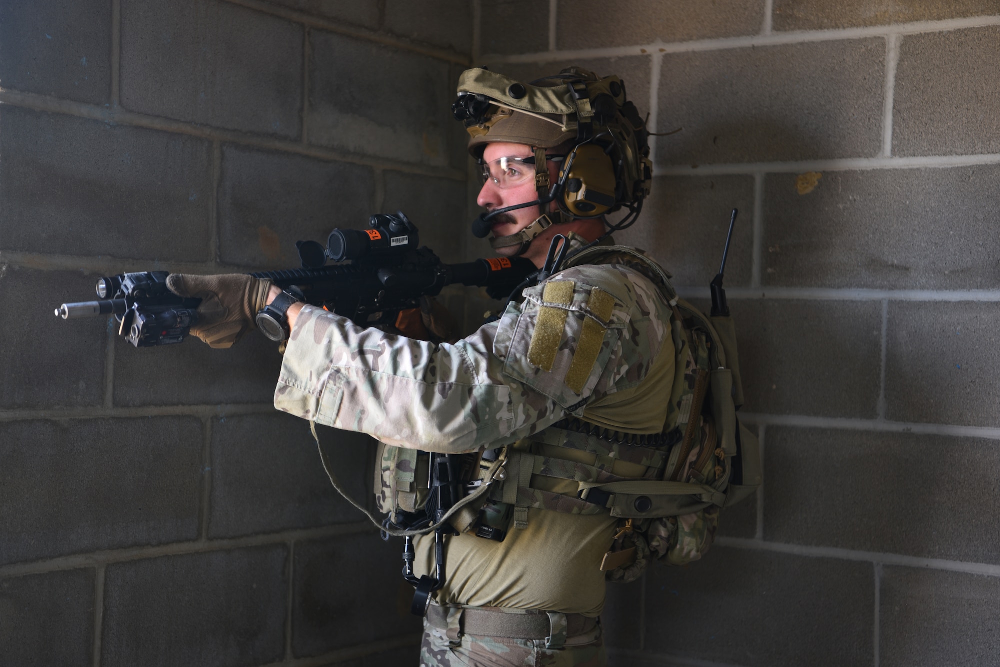 Staff Sgt. Robert Taulman, 91 MSOS/CRF leader, participates in an urban recovery scenario during Joint Training Exercise 2024, at Fort Chaffee, Arkansas, October 15, 2024. During the three-week JTX, Twentieth Air Force Security Forces airmen refined critical response skills alongside the U.S. Office of Secure Transportation and Royal Marines. The exercise provided hands-on experience with advanced weapons handling, live-fire drills, and urban recovery scenarios, enhancing readiness for nuclear security operations. (U.S. Air Force Photo by 1st Lt. Jacqulyn Noffsinger)