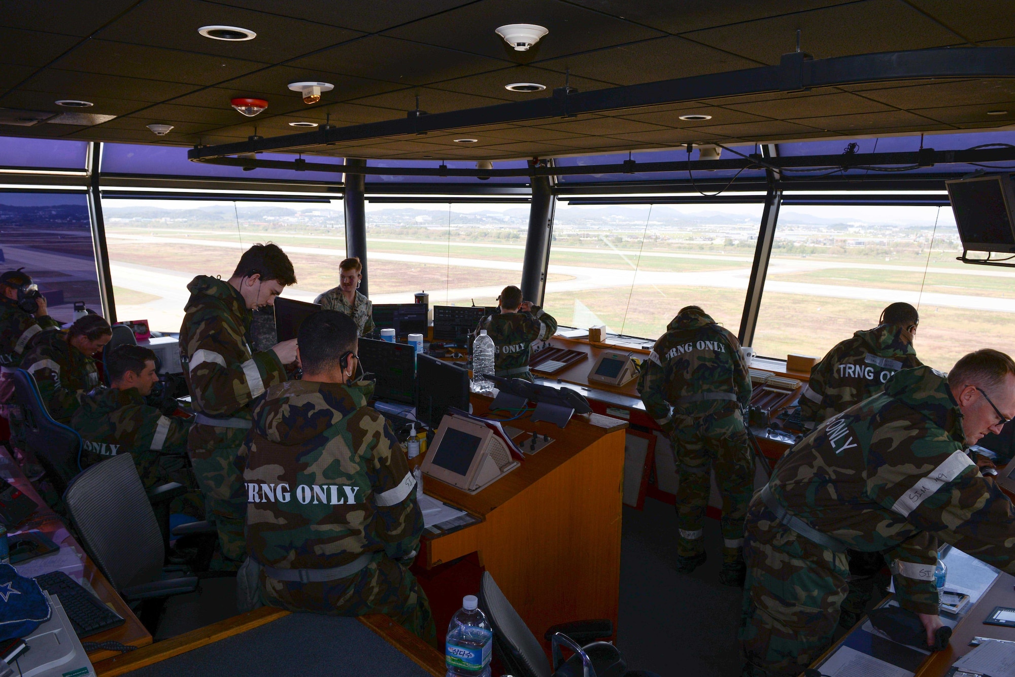 Airmen assigned to the 51st Operations Support Squadron prepare to don their M-50 gas mask during Beverly Herd 25-1 at Osan Air Base, Republic of Korea, Oct. 29, 2024. During the exercise, base personnel demonstrated their ability to navigate various attack scenarios while launching and recovering aircraft during 24-hour flying operations, validating the 51st Fighter Wing’s readiness and response against any adversary. (U.S. Air Force photo by Staff Sgt. Kahdija Slaughter)