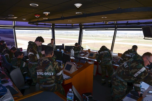 Airmen assigned to the 51st Operations Support Squadron prepare to don their M-50 gas mask during Beverly Herd 25-1 at Osan Air Base, Republic of Korea, Oct. 29, 2024. During the exercise, base personnel demonstrated their ability to navigate various attack scenarios while launching and recovering aircraft during 24-hour flying operations, validating the 51st Fighter Wing’s readiness and response against any adversary. (U.S. Air Force photo by Staff Sgt. Kahdija Slaughter)