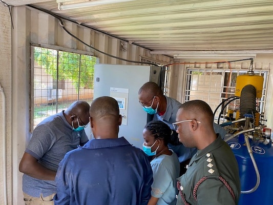 ACCRA, Ghana (Oct. 28, 2024) Pictured: Members of the Ghana Armed Forces 37 Military Hospital and Noguchi Memorial Institute for Medical Research observe maintenance activities on the liquid nitrogen plant, during training facilitated by Naval Medical Research Unit (NAMRU) EURAFCENT. Headquartered in Sigonella, NAMRU EURAFCENT has permanent research sites in Cairo, Egypt and Accra, Ghana, as well as a forward-deployed laboratory at Camp Lemonnier, Djibouti. NAMRU EURAFCENT conducts surveillance and studies of vaccines, therapeutic agents, diagnostic assays and vector control measures to better prevent and treat infectious diseases. (U.S. Navy photo by Lt. Cmdr. Robert Hontz/Released)