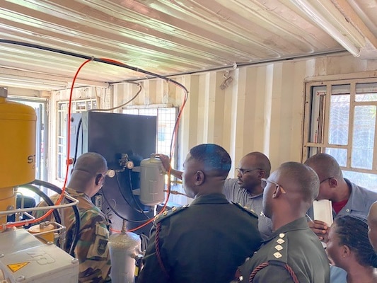 ACCRA, Ghana (Oct. 28, 2024) Pictured: Members of the Ghana Armed Forces 37 Military Hospital and Noguchi Memorial Institute for Medical Research observe maintenance activities on the liquid nitrogen plant, during training facilitated by Naval Medical Research Unit (NAMRU) EURAFCENT. Headquartered in Sigonella, NAMRU EURAFCENT has permanent research sites in Cairo, Egypt and Accra, Ghana, as well as a forward-deployed laboratory at Camp Lemonnier, Djibouti. NAMRU EURAFCENT conducts surveillance and studies of vaccines, therapeutic agents, diagnostic assays and vector control measures to better prevent and treat infectious diseases. (U.S. Navy photo by Lt. Cmdr. Robert Hontz/Released)