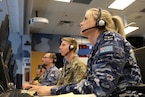 Royal Australian Air Force, Royal Canadian Air Force and United Kingdom members participate in Virtual Flag: Coalition 25 at the 705th Combat Training Squadron, also known as the Distributed Mission Operations Center, at Kirtland Air Force Base, New Mexico, Oct. 30, 2024. Exercise VF:C serves as a train as you fight exercise by integrating the full spectrum of air, land, surface, space, and cyber warfighters in a virtual battlespace in joint and coalition environments; forces from the United States, United Kingdom, Australia, and Canada participated. (Image was cropped to focus on subject.) (U.S. Air Force photo by Mr. Shelton Keel)