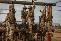 U.S. Marine Corps recruits with Mike Company, 3rd Recruit Training Battalion, navigate an obstacle during the Crucible at Marine Corps Base Camp Pendleton, California, Oct. 29, 2024. The Crucible is a 54-hour exercise where recruits apply the knowledge they learned throughout recruit training to earn the title United States Marine. (U.S. Marine Corps photo by Lance Cpl. Jacob B. Hutchinson)