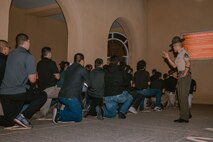 U.S. Marine Corps recruits with Bravo Company, 1st Recruit Training Battalion, are briefed on the Uniform Code of Military Justice as part of a receiving event at Marine Corps Recruit Depot San Diego, California, Oct. 28, 2024. During the receiving process, recruits are taken to the United States Organizations for accountability, checked for contraband, given haircuts, make scripted phone calls home, and issued gear required for training. (U.S. Marine Corps photo by Cpl. Sarah M. Grawcock)