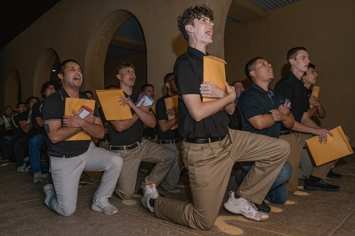 U.S. Marine Corps recruits with Bravo Company, 1st Recruit Training Battalion, are briefed on the Uniform Code of Military Justice as part of a receiving event at Marine Corps Recruit Depot San Diego, California, Oct. 28, 2024. During the receiving process, recruits are taken to the United States Organizations for accountability, checked for contraband, given haircuts, make scripted phone calls home, and issued gear required for training. (U.S. Marine Corps photo by Cpl. Sarah M. Grawcock)
