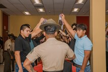 U.S. Marine Corps recruits with Bravo Company, 1st Recruit Training Battalion, are briefed as part of a receiving event at Marine Corps Recruit Depot San Diego, California, Oct. 28, 2024. During the receiving process, recruits are taken to the United States Organizations for accountability, checked for contraband, given haircuts, make scripted phone calls home, and issued gear required for training. (U.S. Marine Corps photo by Cpl. Sarah M. Grawcock)