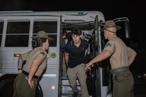 U.S. Marine Corps drill instructors with Receiving Company, Support Battalion, instruct recruits with Bravo Company, 1st Recruit Training Battalion, to get off a bus as part of a receiving event at Marine Corps Recruit Depot San Diego, California, Oct. 28, 2024. During the receiving process, recruits are taken to the United States Organizations for accountability, checked for contraband, given haircuts, make scripted phone calls home, and issued gear required for training. (U.S. Marine Corps photo by Cpl. Sarah M. Grawcock)