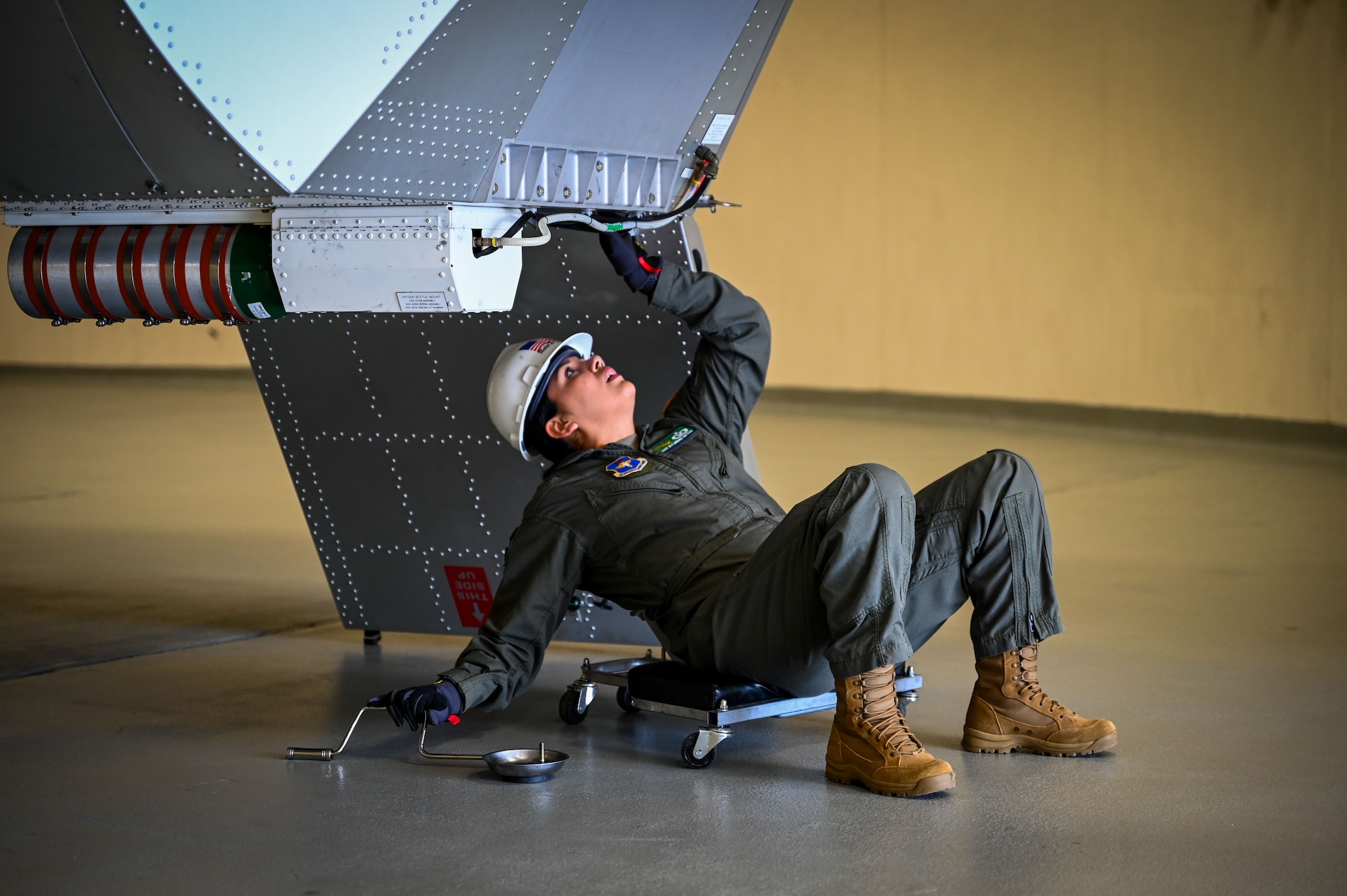 Staff Sgt. Alejandra Ortega Mejia performs maintenance on the centrifuge at the 342nd Training Squadron at Wright-Patterson Air Force Base