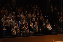 Spectators attending the 2024 National Concert Tour stand for the playing of the National Anthem by "the President's Own" U.S. Marine Corps band on October 22, 2024, in Ogden, Utah. “The President’s Own” United States Marine Band’s mission is to perform music for the President of the United States and the Commandant of the Marine Corps. Founded in 1798 by an Act of Congress, the Marine Band is America’s oldest continuously active professional musical organization. (U.S. Marine Corps photo by Cpl. Luis A. Ponce Alavez Jr.)
