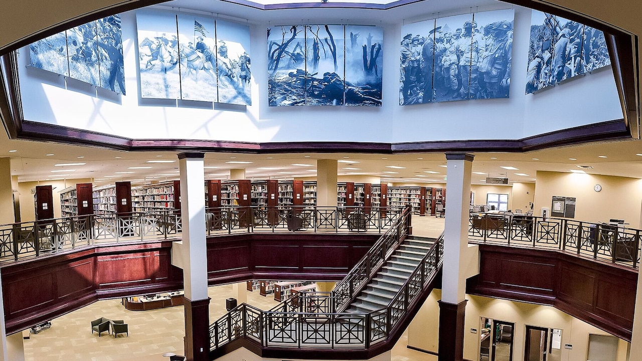 A panoramic photo of two floors of a library is shown.