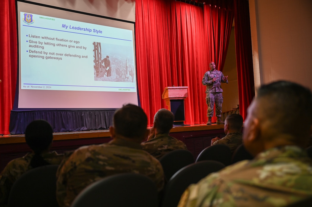 Chief Master Sgt. Jonathan J. Birk, 433rd AW command chief, addresses hundreds of Alamo Wing Reserve Citizen Airmen at a wing stand-up meeting at the Bob Hope Theatre on Joint Base San Antonio-Lackland, Texas Nov. 2, 2024.