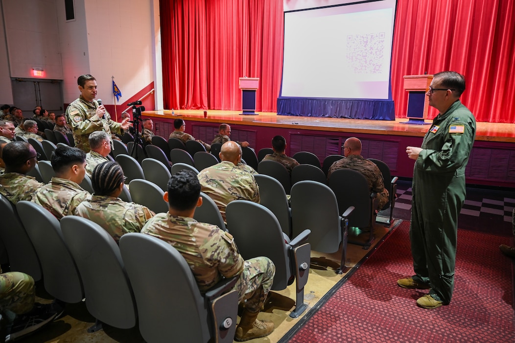 Col. Douglas C. Jeffrey, IV, 433rd Airlift Wing commander, listens as a Reserve Citizen Airmen asks a question during the wing stand-up meeting at the Bob Hope Theatre on at Joint Base San Antonio-Lackland, Texas Nov. 2, 2024.