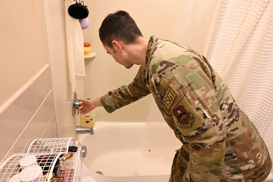 U.S. Air Force Senior Master Sgt. Evan Vandermay, 97th Comptroller Squadron and Wing Staff Agencies first sergeant, performs a room inspection at Altus Air Force Base, Oklahoma, Nov. 8, 2024. First sergeant’s primary mission is the health and well-being of Airmen. (U.S. Air Force photo by Senior Airman Miyah Gray)