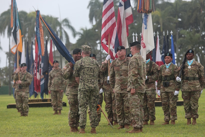 Gen. Ronald P. Clark, incoming U.S. Army Pacific commanding general, receives the colors from Admiral Samuel Paparo, Commander of U.S. Indo-Pacific Command at a change of command ceremony at Fort Shafter, Hawaii, Nov. 8, 2024,