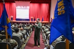 Col. Douglas C. Jeffrey, IV, 433rd Airlift Wing commander, speaks during one of the three wing stand-up sessions at the Bob Hope Theatre on Joint Base San Antonio-Lackland, Texas Nov. 2, 2024.