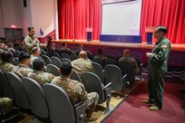 Col. Douglas C. Jeffrey, IV, 433rd Airlift Wing commander, listens as a Reserve Citizen Airmen asks a question during the wing stand-up meeting at the Bob Hope Theatre on at Joint Base San Antonio-Lackland, Texas Nov. 2, 2024.