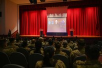 Hundreds of 433rd Airlift Wing Reserve Citizen Airmen watch a video presentation from Air Force Chief of Staff Gen. David W. Allvin during one of three wing stand-up sessions with a focus on risk management and operational discipline at the Bob Hope Theatre at Joint Base San Antonio-Lackland, Texas Nov. 2, 2024.