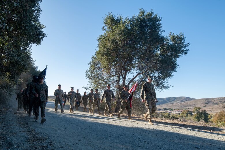 U.S. Marines with Marine Aerial Refueler Transport Squadron (VMGR) 352, Marine Aircraft Group 11, 3rd Marine Aircraft Wing, participate in a Veteran's Day flag run and hike in San Diego, Nov. 7, 2024. The event, spearheaded by Capt. Tyler Chittick, began at MCAS Miramar and will end at the School of Infantry West, Marine Corps Base Camp Pendleton totaling 55 miles of relay run and hike. Each year Chittick brings Marines together to complete a challenging physical activity in honor of fallen and disabled veterans including a fellow Marine who was injured by an improvised explosive device in Afghanistan in 2011. (U.S. Marine Corps photo by Sgt. Luc Boatman)