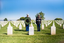 U.S. Marine Corps Col. Jason S. Freeby, the battalion commander of Headquarters and Service Battalion, left, and SgtMaj. Thomas A. Bachman, the SgtMaj. of Headquarters and Service Battalion, right, pause for a moment of silence for former Sergeant Major of the Marine Corps, Sgt. Maj. Leland D. Crawford, at Fort Rosecrans National Cemetery, San Diego, California, Nov. 10, 2024. The wreath laying ceremonies are a continuing part of the Marine Corps birthday tradition and honor the service to Corps and Country. (U.S. Marine Corps photo by Cpl. Francisco Angel)