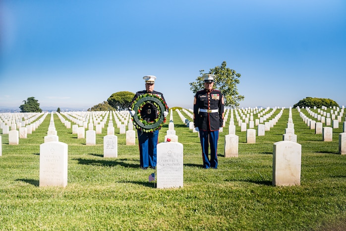 U.S. Marine Corps Col. Jason S. Freeby, the battalion commander of Headquarters and Service Battalion, left, and SgtMaj. Thomas A. Bachman, the SgtMaj. of Headquarters and Service Battalion, right, pause for a moment of silence for former Sergeant Major of the Marine Corps, Sgt. Maj. Leland D. Crawford, at Fort Rosecrans National Cemetery, San Diego, California, Nov. 10, 2024. The wreath laying ceremonies are a continuing part of the Marine Corps birthday tradition and honor the service to Corps and Country. (U.S. Marine Corps photo by Cpl. Francisco Angel)