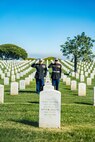 U.S. Marine Corps Col. Jason S. Freeby, the battalion commander of Headquarters and Service Battalion, left, and Sgt. Maj. Thomas A. Bachman, the sergeant major of Headquarters and Service Battalion, right, render a salute to the headstone of former Sergeant Major of the Marine Corps, Sgt. Maj. Leland D. Crawford, at Fort Rosecrans National Cemetery, San Diego, California, Nov. 10, 2024. The wreath laying ceremonies are a continuing part of the Marine Corps birthday tradition and honor the service to Corps and Country. (U.S. Marine Corps photo by Cpl. Francisco Angel)