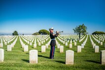 U.S. Marine Corps Sgt. Hunter Rockhill, a musician with the Marine Band San Diego, plays Taps during the wreath laying ceremony for former Sergeant Major of the Marine Corps, Sgt. Maj. Leland D. Crawford, at Fort Rosecrans National Cemetery, San Diego, California, Nov. 10, 2024. The wreath laying ceremonies are a continuing part of the Marine Corps birthday and tradition and honor the service to Corps and Country. (U.S. Marine Corps photo by Cpl. Francisco Angel)