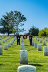 U.S. Marine Corps Col. Jason S. Freeby, the battalion commander of Headquarters and Service Battalion, left, and Sgt. Maj. Thomas A. Bachman, the sergeant major of Headquarters and Service Battalion, right, pause for a moment of silence for former Sergeant Major of the Marine Corps, Sgt. Maj. Leland D. Crawford, at Fort Rosecrans National Cemetery, San Diego, California, Nov. 10, 2024. The wreath laying ceremonies are a continuing part of the Marine Corps birthday tradition and honor the service to Corps and Country. (U.S. Marine Corps photo by Cpl. Francisco Angel)