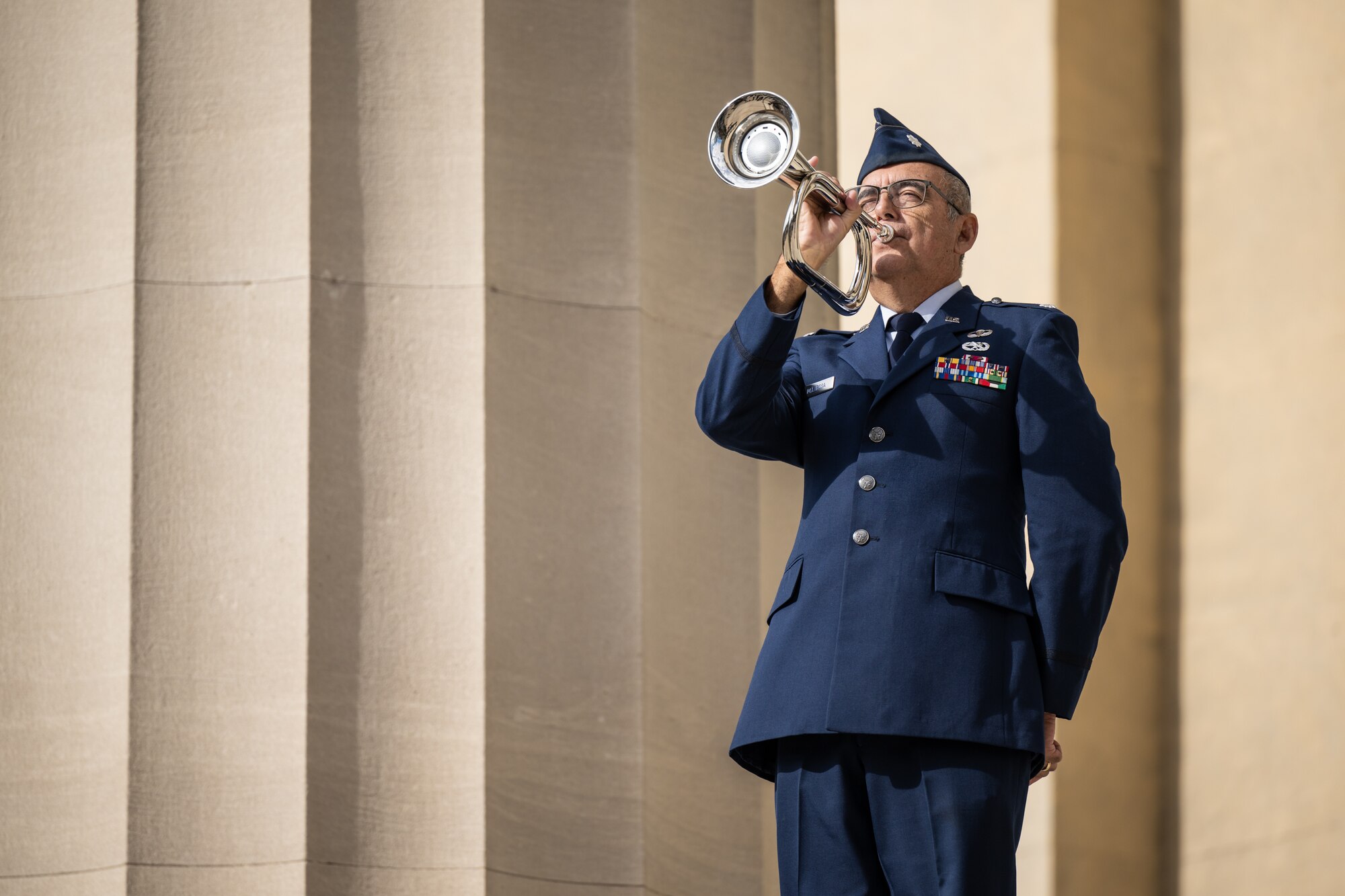 U.S. Air Force Lt. Col Mitch DeLaRosa, retired, plays Taps to close out the annual Veterans Day Parade and Massing of the Colors in downtown Louisville, Ky., on Nov. 9. 2024. The event featured appearances by more than 50 organizations, including the Kentucky Air National Guard and its Mini C-130 Hercules scale replica. (U.S. Air National Guard photo by Dale Greer)