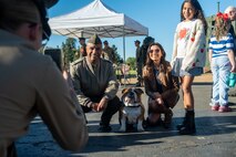 U.S. Marine Corps Lt. Col. Kenneth W. Smith, with Marine Air Control Group 38, 3rd Marine Aircraft Wing, left, poses with Lance Cpl. Bruno and his family, during a veteran’s appreciation day event at Sunset Hills Elementary School, San Diego, Nov. 7, 2024. Sunset Hills Elementary school held the event to showcase the brave men and women who serve this country and in the local community. (U.S. Marine Corps photo by Cpl. Francisco Angel)