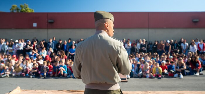 U.S. Marine Corps Lt Col. Kenneth W. Smith with Marine Air Control Group 38, 3rd Marine Aircraft Wing, speaks to students from Sunset Hills Elementary School during a veteran’s appreciation day event, San Diego, Nov. 7, 2024. Sunset Hills Elementary school held the event to showcase the brave men and women who serve this country and in the local community. (U.S. Marine Corps photo by Cpl. Francisco Angel)