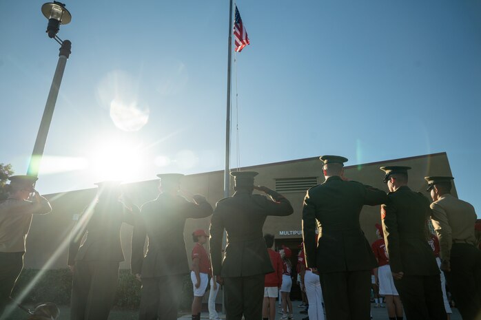 U.S. Marines with Marine Air Control Group 38, 3rd Marine Aircraft Wing and Marine Corps Recruit Depot San Diego render a salute during the flag raising ceremony at Sunset Hills Elementary School, San Diego, Nov. 7, 2024. Sunset Hills Elementary school held the event to showcase the brave men and women who serve this country and in the local community. (U.S. Marine Corps photo by Cpl. Francisco Angel)