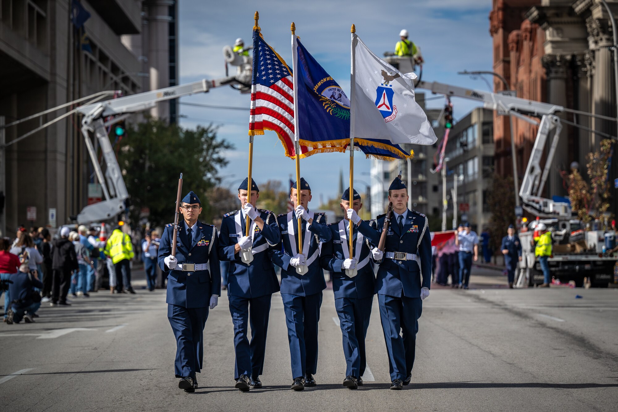 The Civil Air Patrol’s Louisville Cadet Squadron 039 Color Guard marches down Jefferson Street during the annual Veterans Day Parade in downtown Louisville, Ky., Nov. 9, 2024. The event featured appearances by more than 50 organizations, including the Kentucky Air National Guard and its Mini C-130 Hercules scale replica. (U.S. Air National Guard photo by Dale Greer)