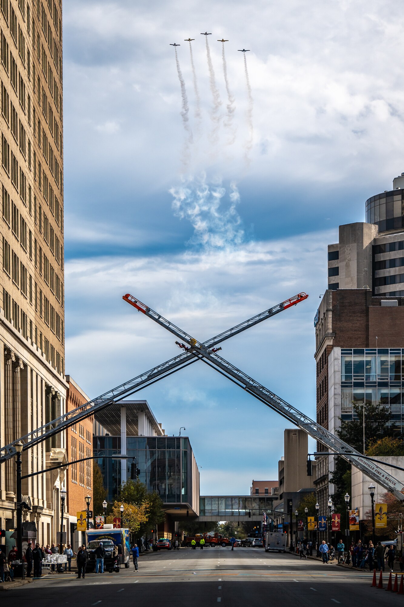 Smoke On Aviation performs a fly-over along Jefferson Street in downtown Louisville, Ky., Nov. 9, 2024, to kick off the city’s annual Veterans Day Parade. The event featured appearances by more than 50 organizations, including the Kentucky Air National Guard and its Mini C-130 Hercules scale replica. (U.S. Air National Guard photo by Dale Greer)