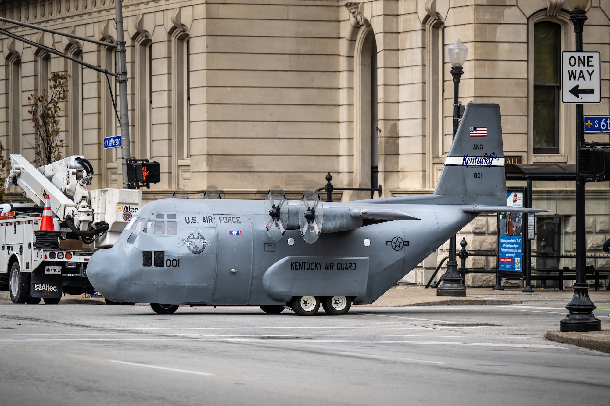 The Kentucky Air National Guard’s Mini C-130 makes an appearance at the annual Veterans Day Parade in downtown Louisville, Ky., Nov. 9, 2024. The non-flying scale replica of a C-130 Hercules transport aircraft was fabricated by Airmen from the unit’s 123rd Maintenance Group. (U.S. Air National Guard photo by Dale Greer)