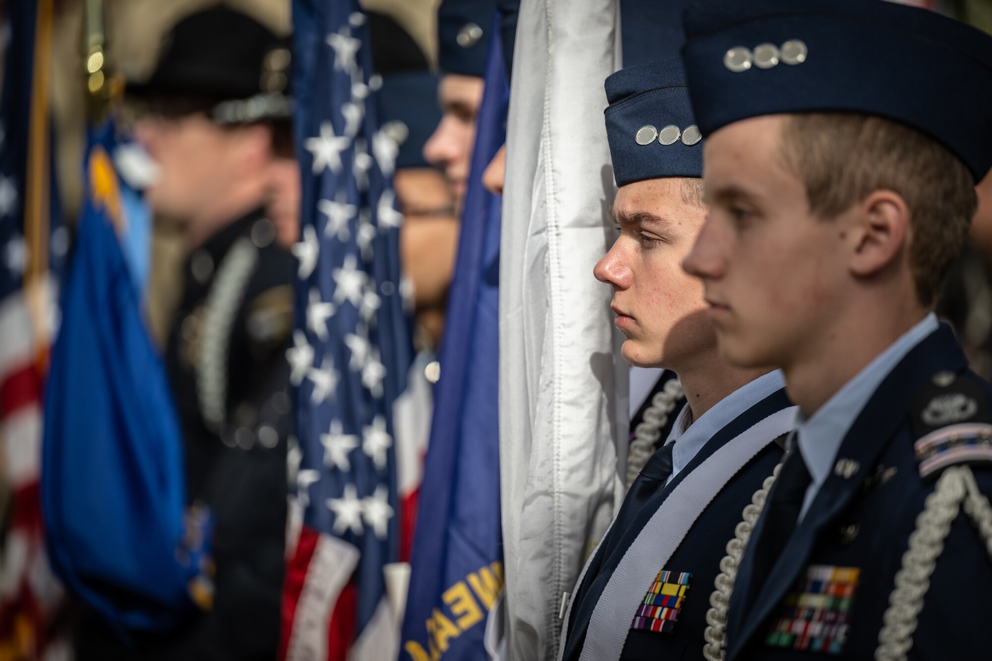 The Civil Air Patrol’s Louisville Cadet Squadron 039 Color Guard participates in the Massing of the Colors during the annual Veterans Day Parade in downtown Louisville, Ky., Nov. 9, 2024. The event featured appearances by more than 50 organizations, including the Kentucky Air National Guard and its Mini C-130 Hercules scale replica. (U.S. Air National Guard photo by Dale Greer)