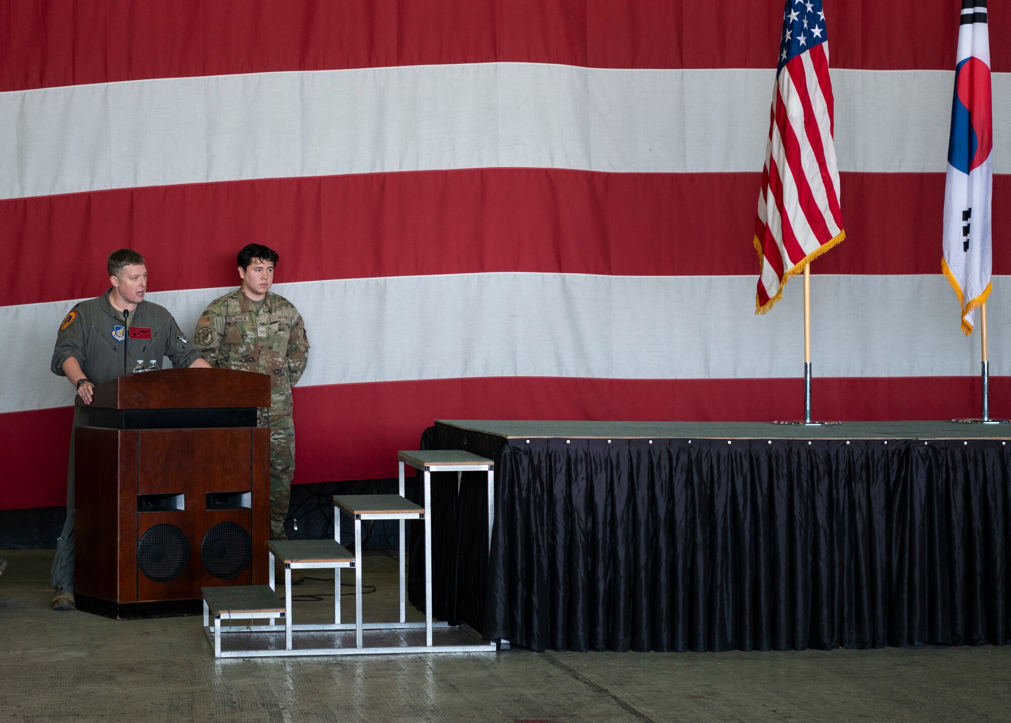 U.S. Air Force Lt. Col Eric Foster, 36th Fighter Squadron commander, gives opening remarks during the 36th Fighter Generation Squadron Dedicated Crew Chief Ceremony at Osan Air Base, Republic of Korea, Oct. 25th, 2024.  The DCC Ceremony is a time honored tradition held to celebrate the crew chiefs’ hard work and dedication to their craft. (U.S. Air Force photo by Staff Sgt. Ashley N. Mikaio)