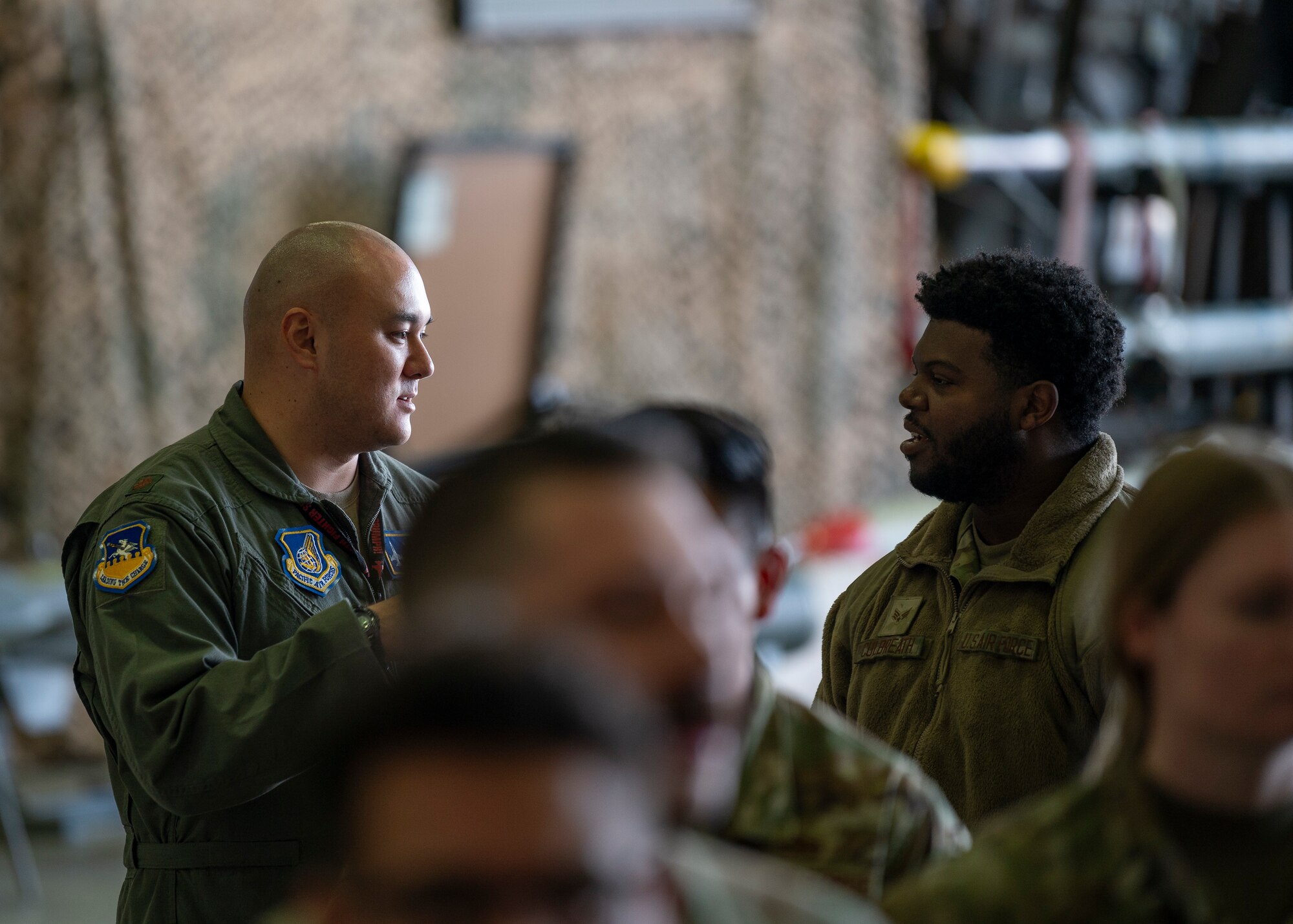 U.S. Air Force Maj. Ty Perich, 51st Fighter Wing chief of safety, speaks to a newly appointed dedicated crew chief after a Dedicated Crew Chief Ceremony at Osan Air Base, Republic of Korea, Oct. 25, 2024. The DCCs and pilots work together to ensure the aircraft they are responsible for take off and land safely. Their cooperative relationship is another reason the 36th Fighter Squadron and 36th Fighter Generation Squadron are always ready to “Fight Tonight” and defend the peninsula. (U.S. Air Force photo by Staff Sgt. Ashley N. Mikaio)