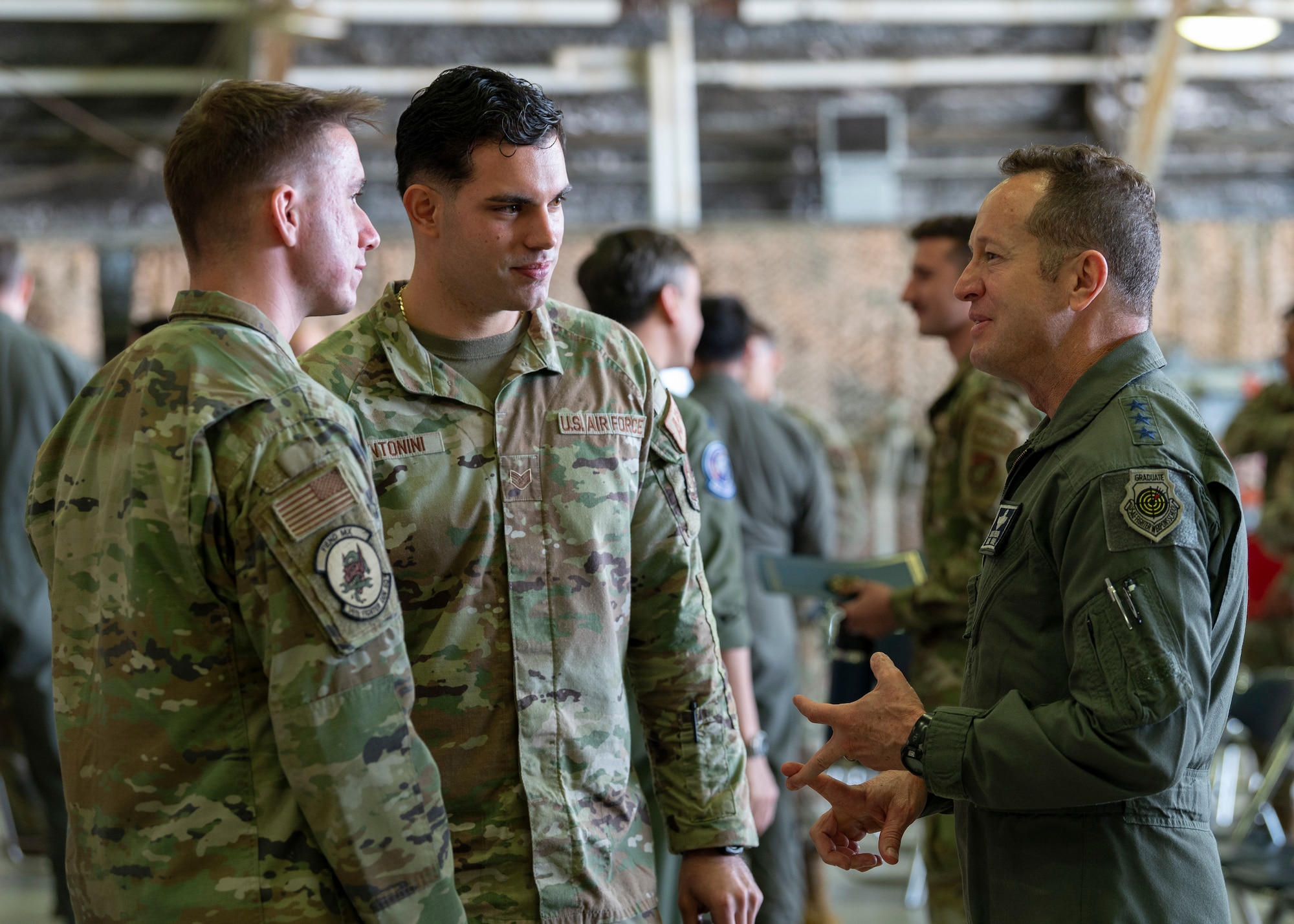 U.S. Air Force Lt. Gen. David Iverson, right, Seventh Air Force commander, speaks with newly appointed dedicated crew chiefs at a Dedicated Crew Chief Ceremony at Osan Air Base, Republic of Korea, Oct. 25, 2024. The DCC ceremony is a chance to recognize the accomplishments and hard work of the maintainers. Once formally made a DCC, the Airmen will have their names written on the side of the aircraft they work on, a longstanding tradition that lasts throughout the aircraft’s lifespan. (U.S. Air Force photo by Staff Sgt. Ashley N. Mikaio)