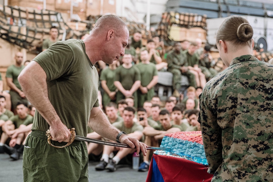 U.S. Marine Corps Col. Sean Dynan, commanding officer of the 15th Marine Expeditionary Unit and a native of Massachusetts, cuts the ceremonial birthday cake during a ceremony aboard the amphibious assault ship USS Boxer (LHD 4) in the Pacific Ocean Nov. 10, 2024. The cake cutting ceremony was held on the second day of the 15th MEU’s 249th Marine Corps birthday celebrations as Boxer transited past the international dateline. Elements of the 15th MEU are currently embarked aboard Boxer and are conducting routine operations in U.S. 3rd Fleet. (U.S. Marine Corps photo by Sgt. Amelia Kang)