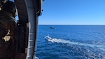 A U.S. Air Force HH-60G Pave Hawk rescue helicopter assigned with the 129th Rescue Squadron, 129th Rescue Wing, California Air National Guard, hovers over a fishing vessel to evacuate an ill fisherman about 400 miles off the San Diego coast Nov. 8, 2024. The patient was on a chartered fishing trip when he began experiencing stroke symptoms.